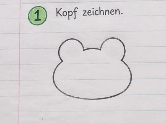 Feld 1: Breiter Froschkopf mit zwei runden Buckeln oben.